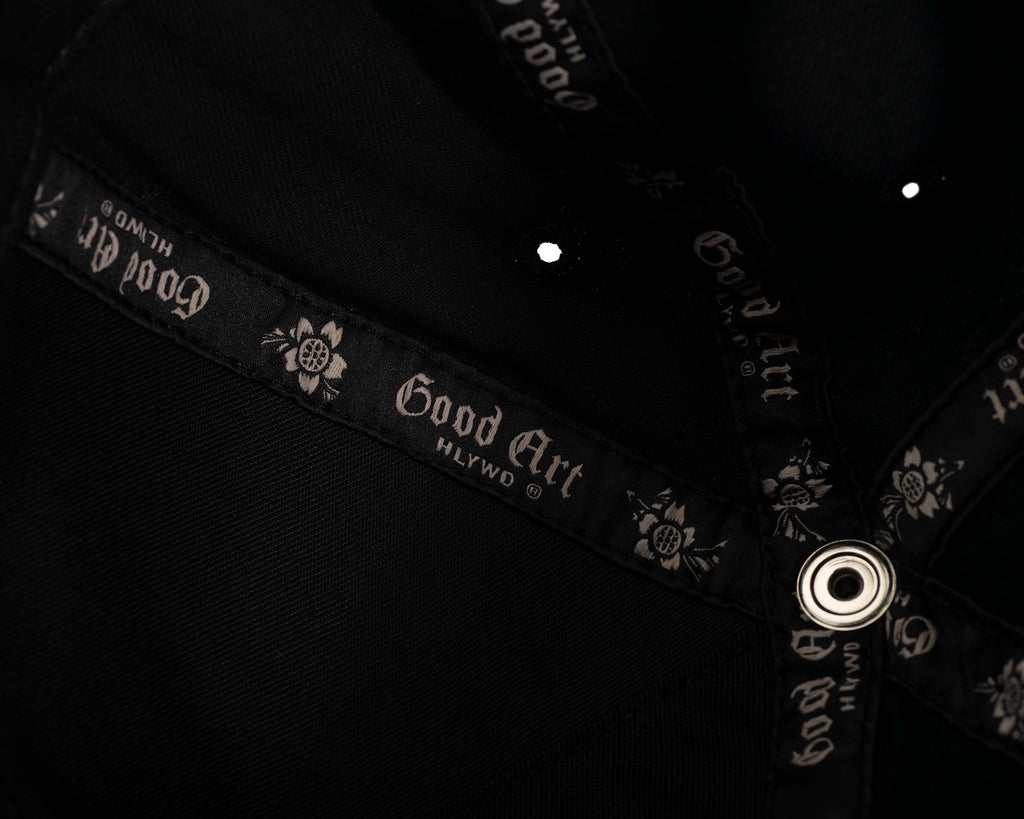 inside stitching of the hat. Good Art logo